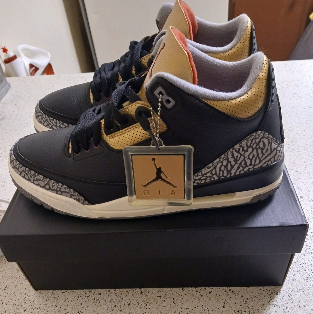 Air Jordan Black and Gold Sneakers